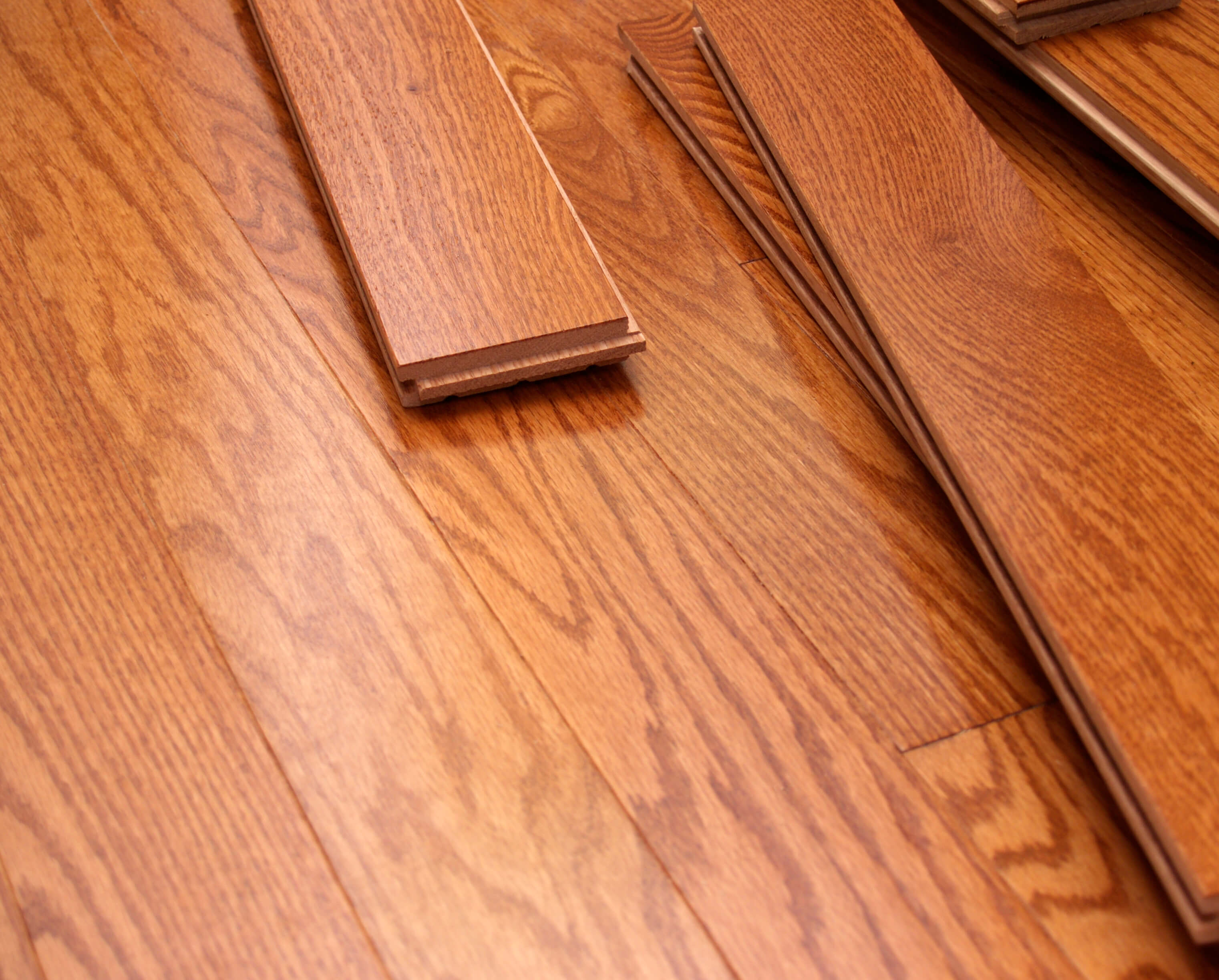 Oak hardwood floor with some loose wood planks